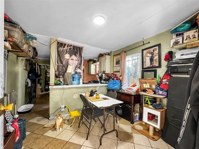 a view of a workspace with furniture and a ceiling fan