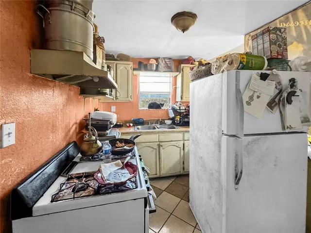 an aerial view of a house with a yard and garden