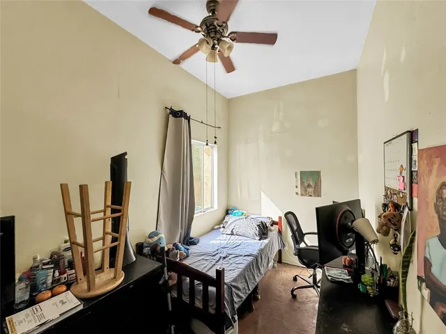 an aerial view of a house with a yard and garden