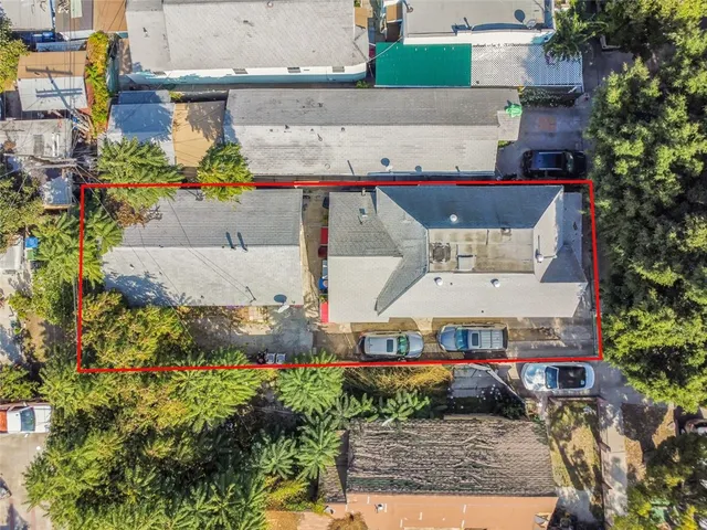 an aerial view of a house with a yard