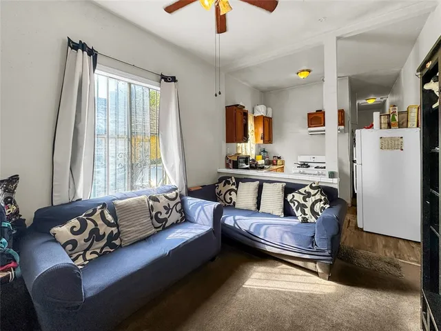 a kitchen with stainless steel appliances a sink and a refrigerator