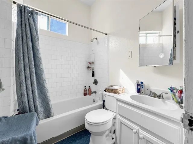 a view of house with backyard and entertaining space