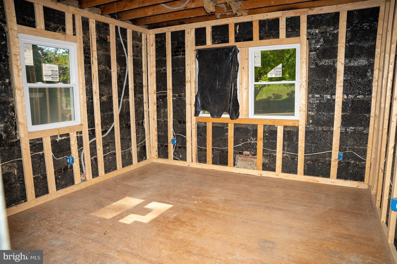 3704 Suitland Road Southeast Washington, DC 20020 - Photo 11 of 25 a view of a brick house with large windows