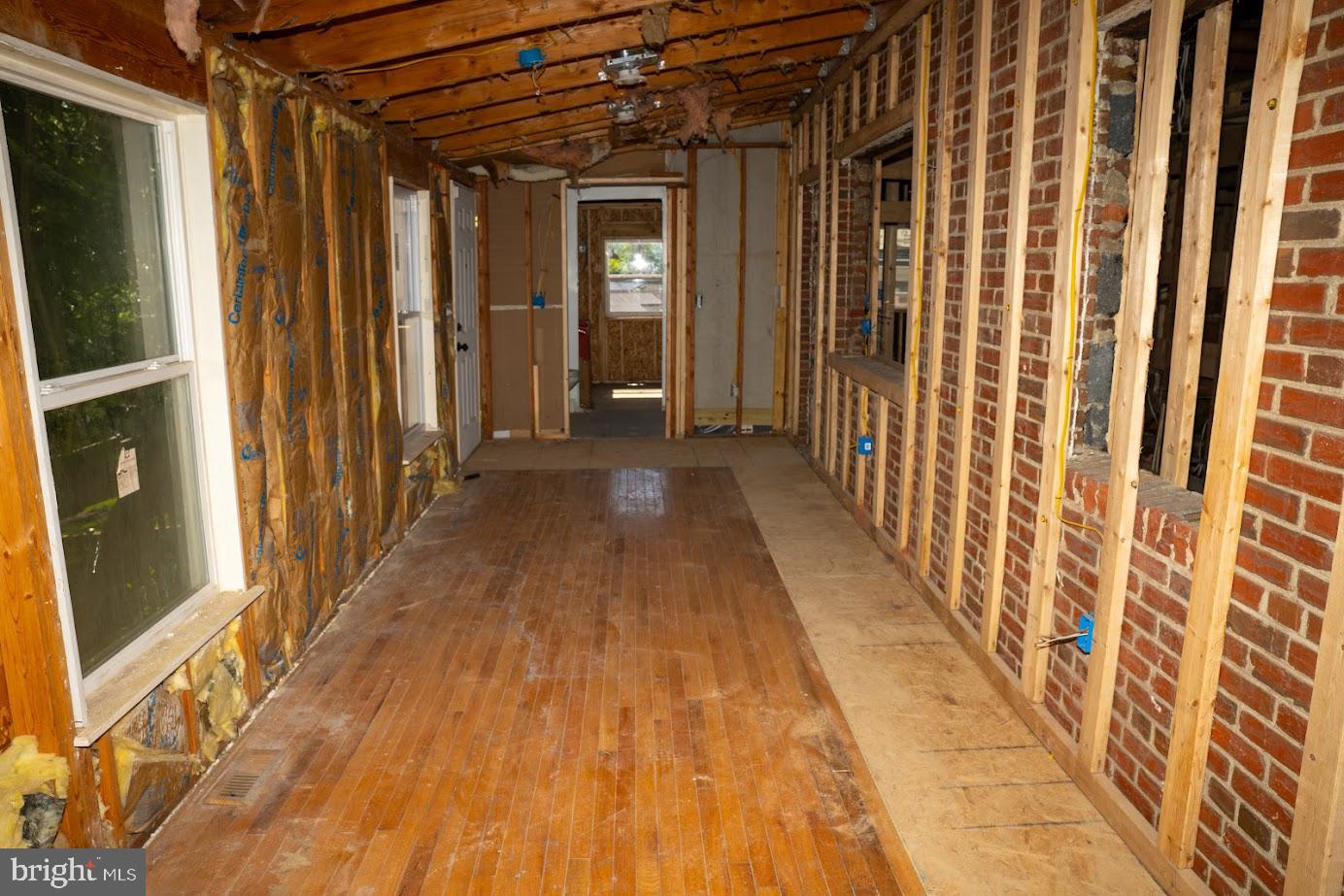 3704 Suitland Road Southeast Washington, DC 20020 - Photo 13 of 25 a view of a porch with wooden floor and a gate