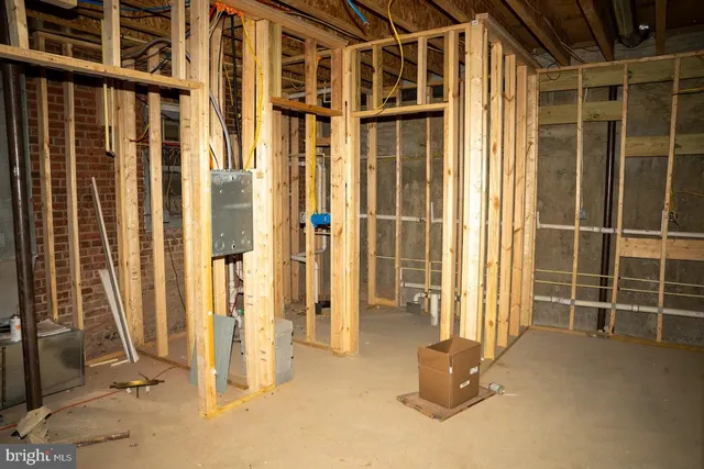 a view of a balcony with wooden floor and a sink