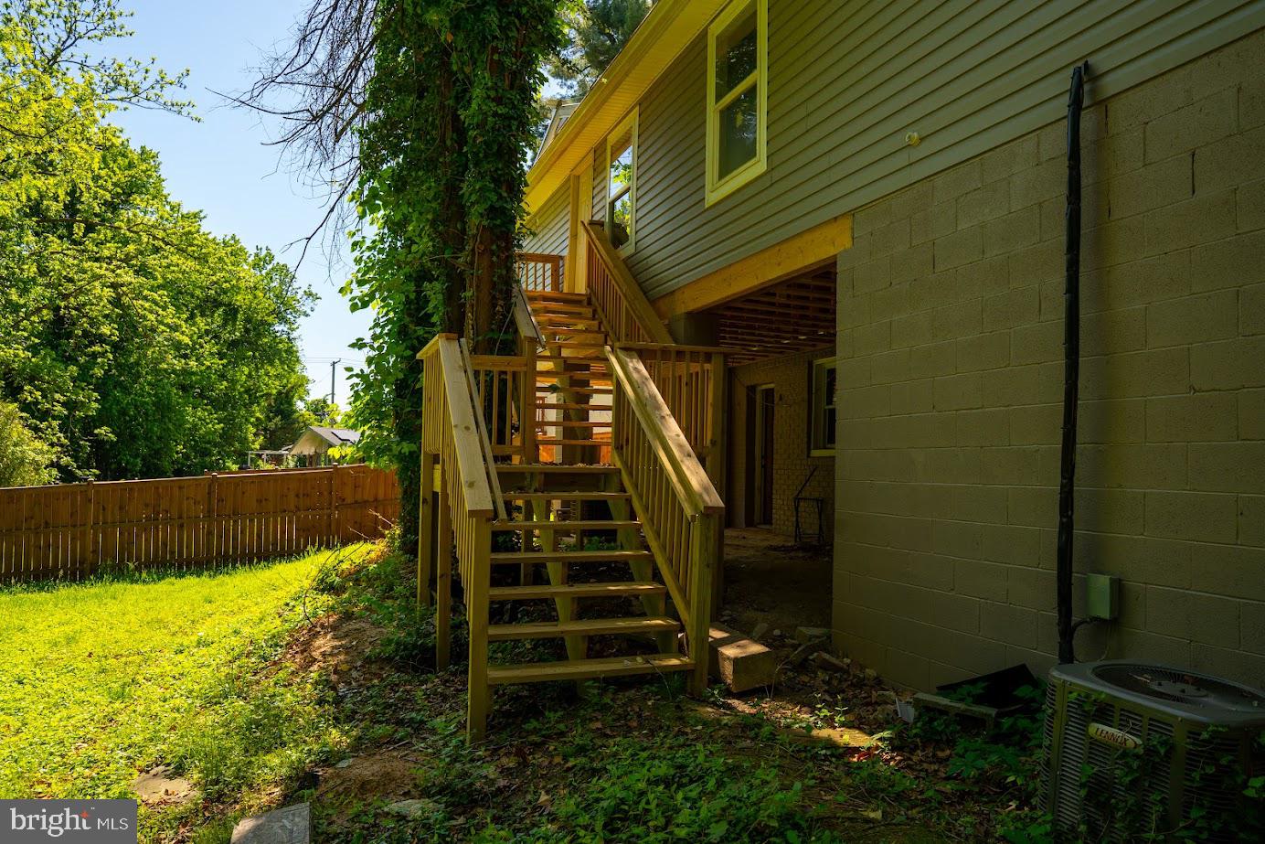 3704 Suitland Road Southeast Washington, DC 20020 - Photo 6 of 25 a view of a house with backyard and wooden fence