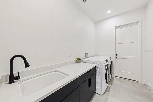 a porch with chairs and wooden floor