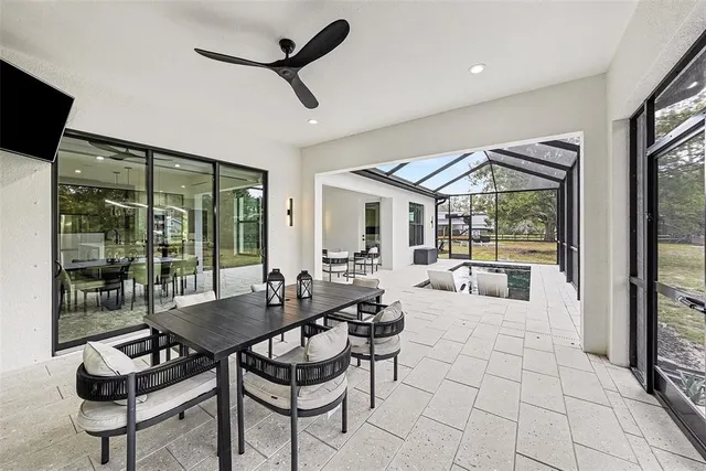 a bedroom with furniture and a flat screen tv