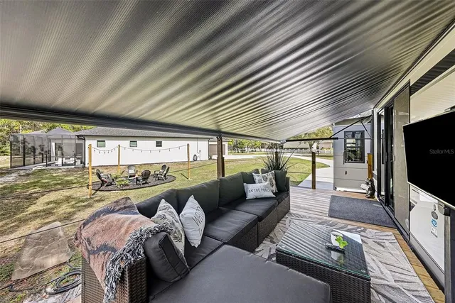 a kitchen with stainless steel appliances granite countertop a stove and a microwave