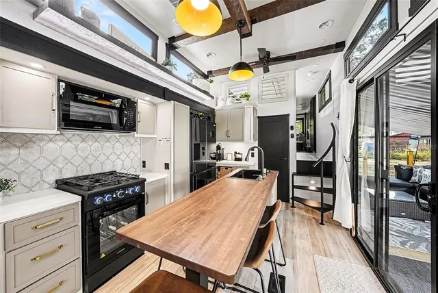 a bedroom with a large bed and a tv