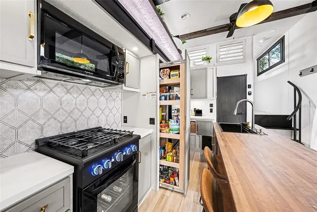 a bedroom with a bed and a large mirror