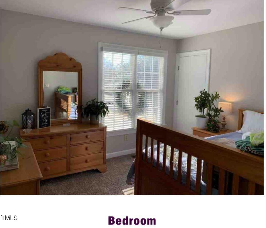 180 Loop Road Archer Lodge, NC 27527 - Photo 18 of 24 a black and white photo of a living room