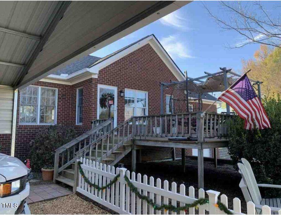 180 Loop Road Archer Lodge, NC 27527 - Photo 8 of 24 a view of house with a roof deck