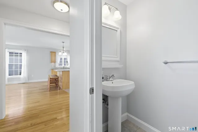 a bathroom with a sink a mirror and a shower