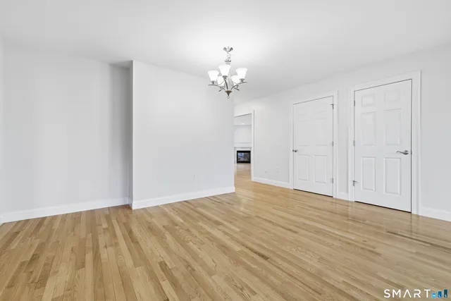 a view of a livingroom with a chandelier fan
