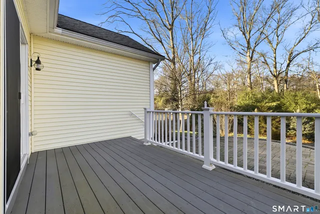 a view of deck with wooden floor and fence