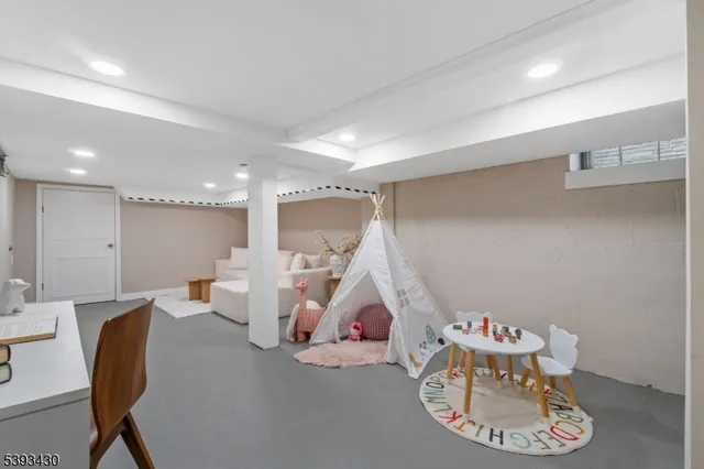 a room with furniture and white walls