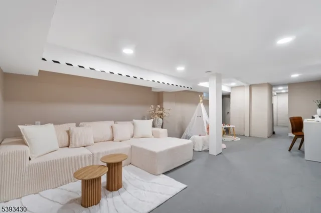 a living room with furniture and a table