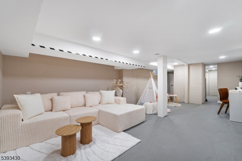 330 John Street Elizabeth, NJ 07202 - Photo 16 of 17 a living room with furniture and a table