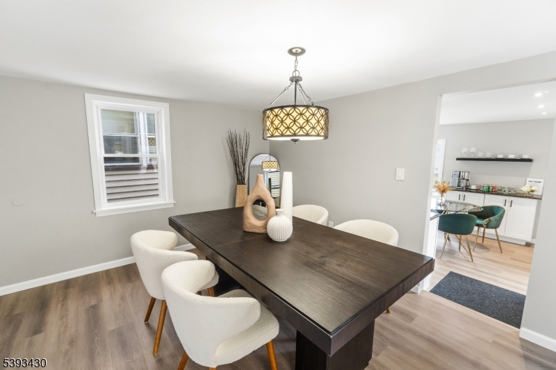 330 John Street Elizabeth, NJ 07202 - Photo 4 of 17 a view of a dining room with furniture and wooden floor