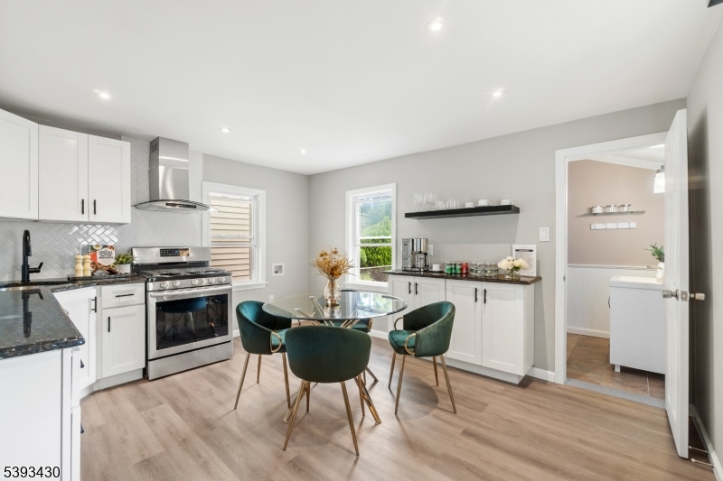 330 John Street Elizabeth, NJ 07202 - Photo 6 of 17 a kitchen with a stove a sink and a refrigerator
