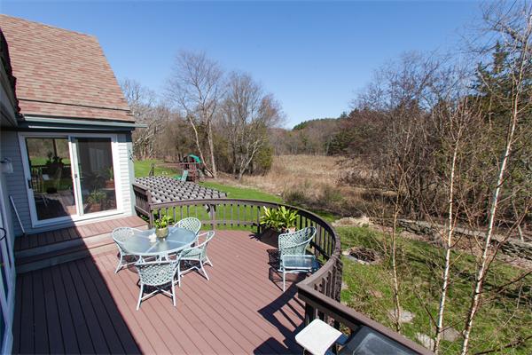 88 Crowell Farm Road Concord, MA 01742 - Photo 15 of 21 a balcony with wooden floor table and chairs