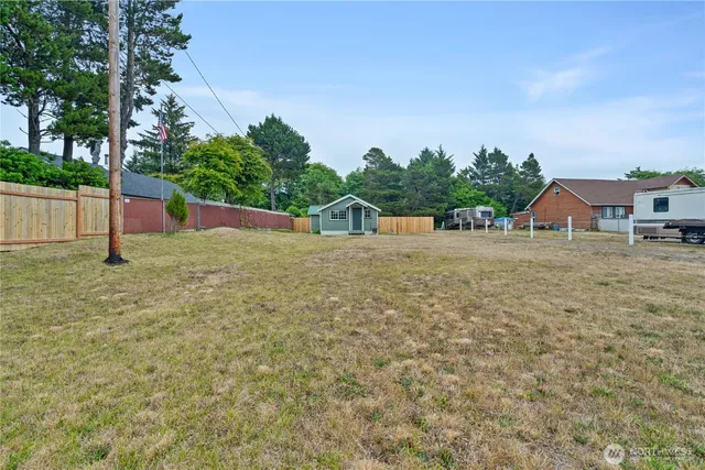 a view of a house with a yard and plants