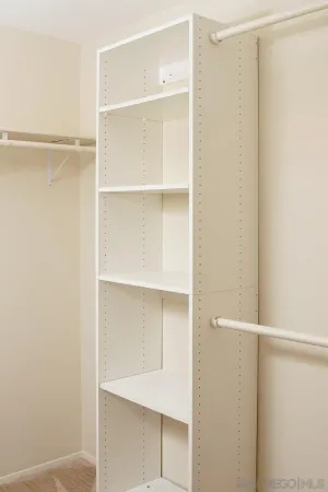 a view of an empty walk in closet