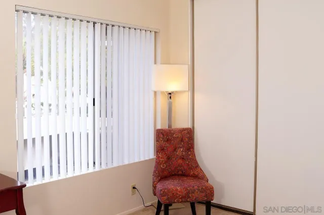 a living room with furniture and a gate