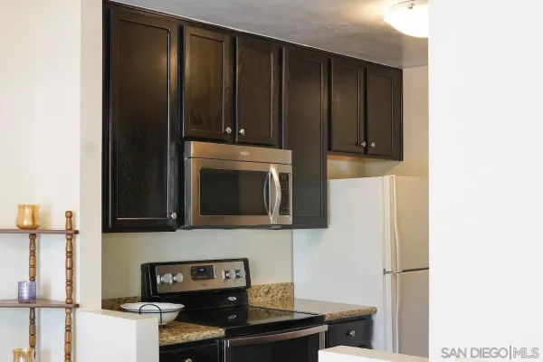 a kitchen with a stove and a microwave