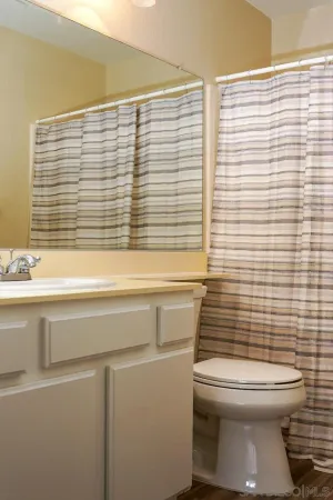 a bathroom with a toilet and a sink