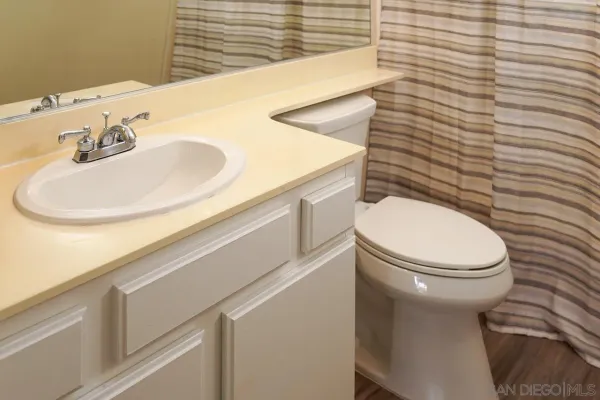 a bathroom with a toilet and a sink