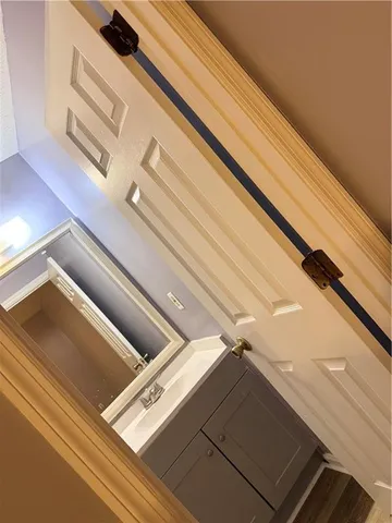 a bathroom with a sink and toilet