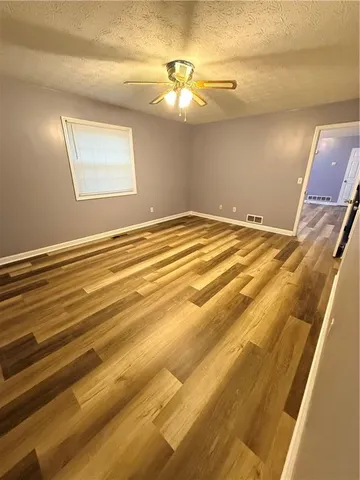 a view of bathroom with a sink and mirror
