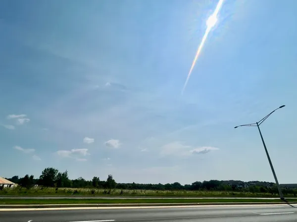 an aerial view of field with trees