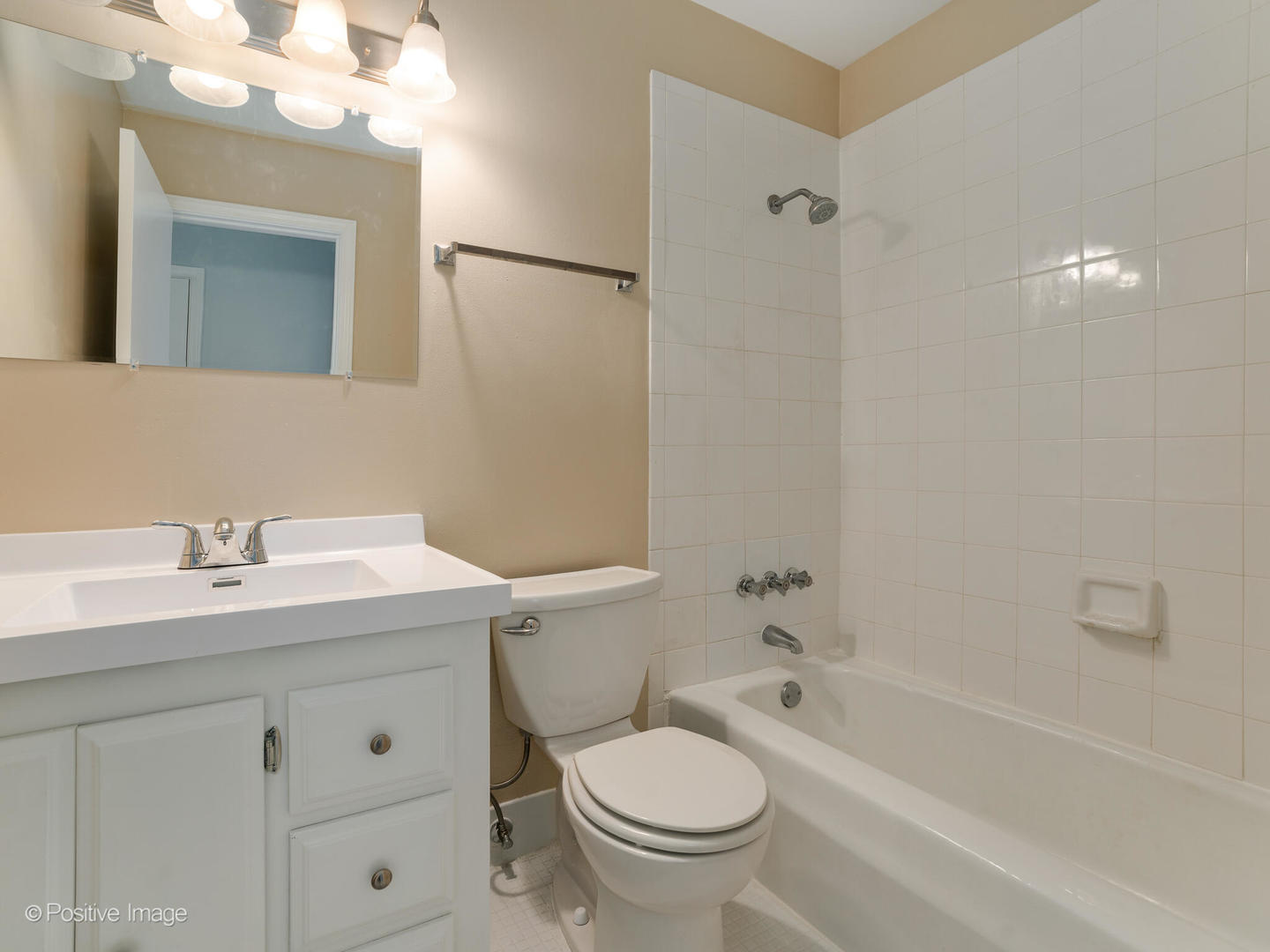 2407 South Goebbert Road, Unit 201 Arlington Heights, IL 60005 - Photo 16 of 20 a bathroom with a granite countertop sink toilet and shower