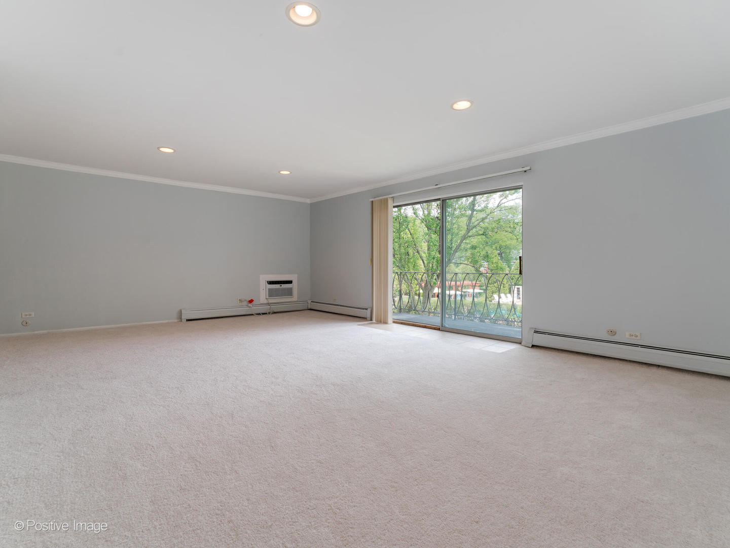 2407 South Goebbert Road, Unit 201 Arlington Heights, IL 60005 - Photo 4 of 20 a view of an empty room with a window