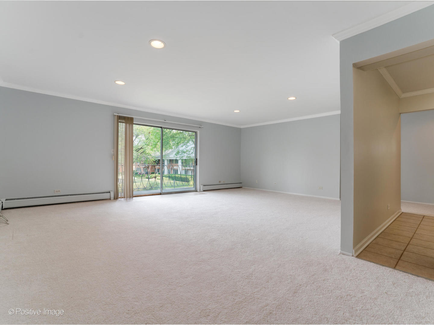 2407 South Goebbert Road, Unit 201 Arlington Heights, IL 60005 - Photo 6 of 20 a view of an empty room with a window