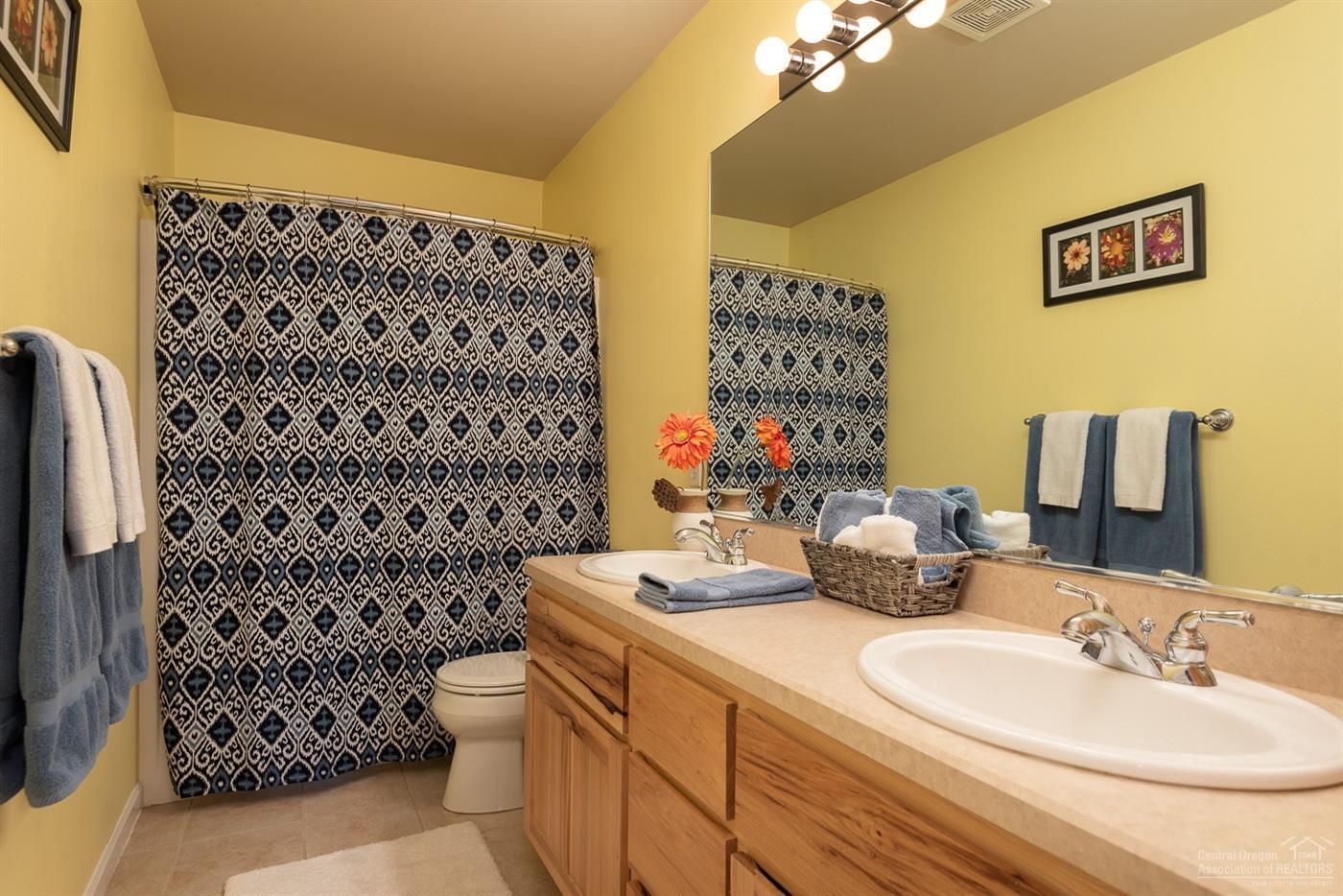 3341 Northeast Stonebrook Loop Bend, OR 97701 - Photo 19 of 25 a bathroom with a sink toilet and shower