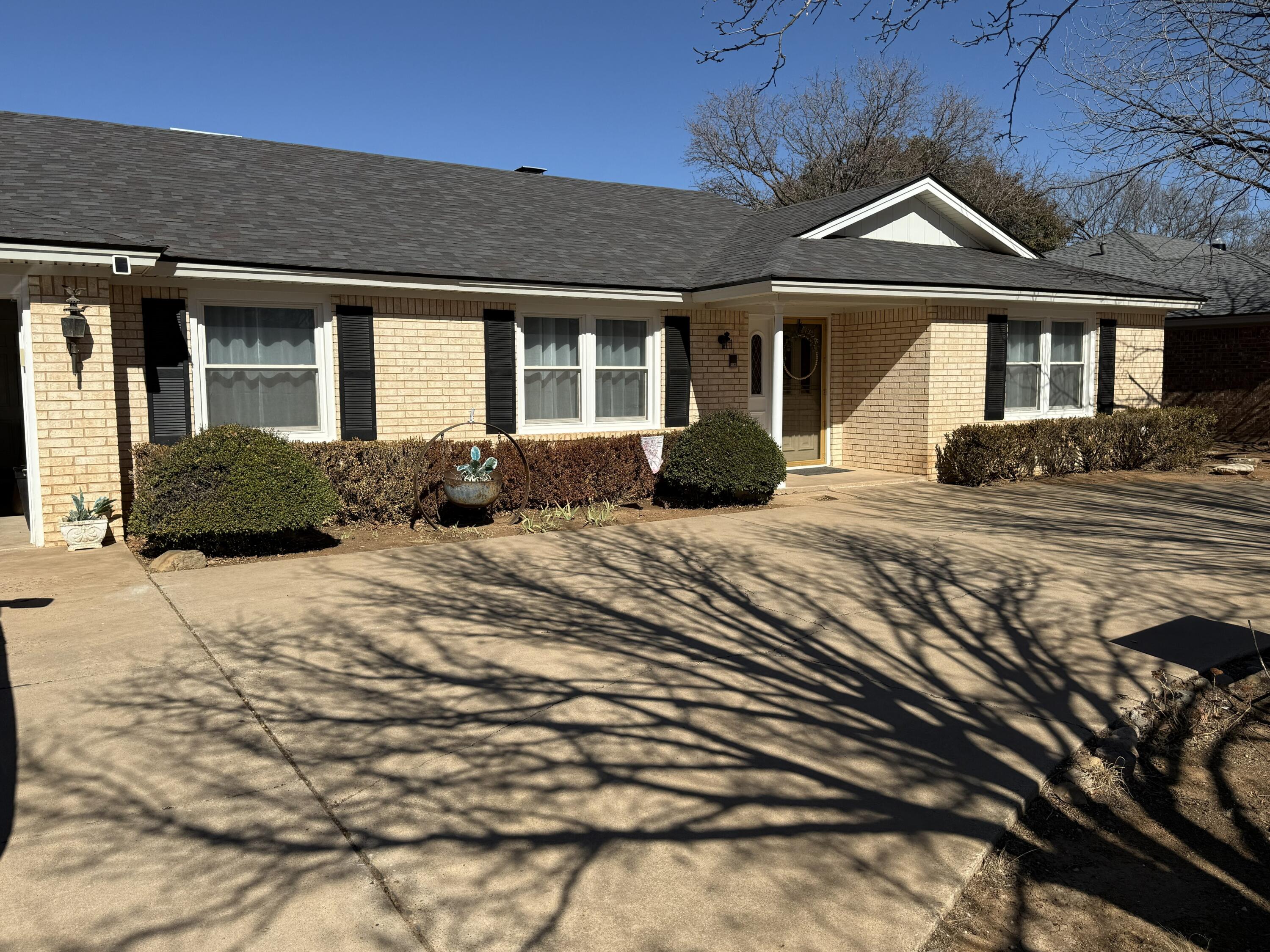 5722 75th Street Lubbock, TX 79424 - Photo 29 of 29 a front view of a house with a yard
