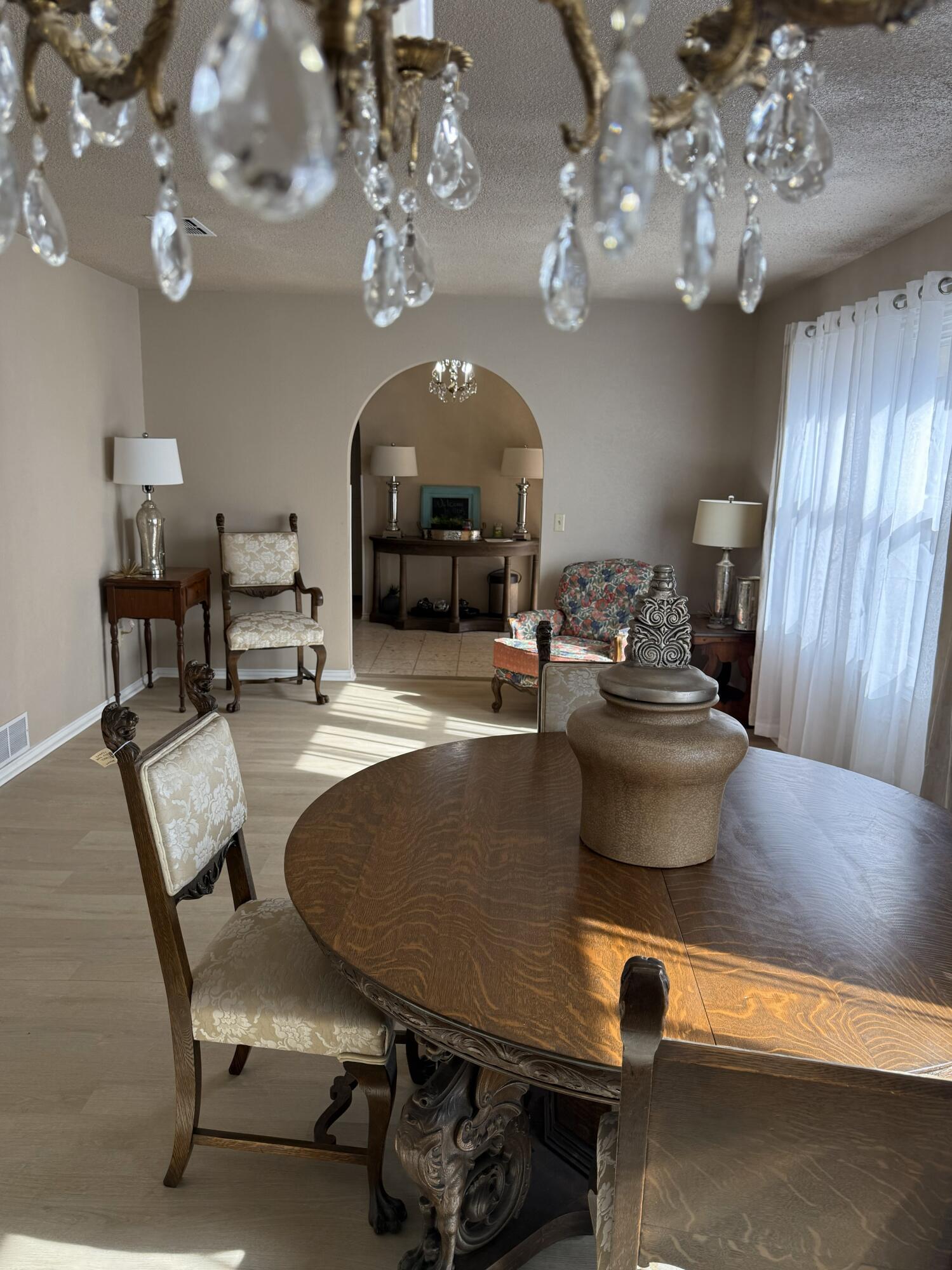 5722 75th Street Lubbock, TX 79424 - Photo 10 of 29 a living room with furniture a chandelier and a chandelier