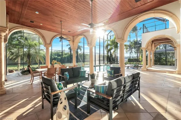a view of a patio with dining table and chairs