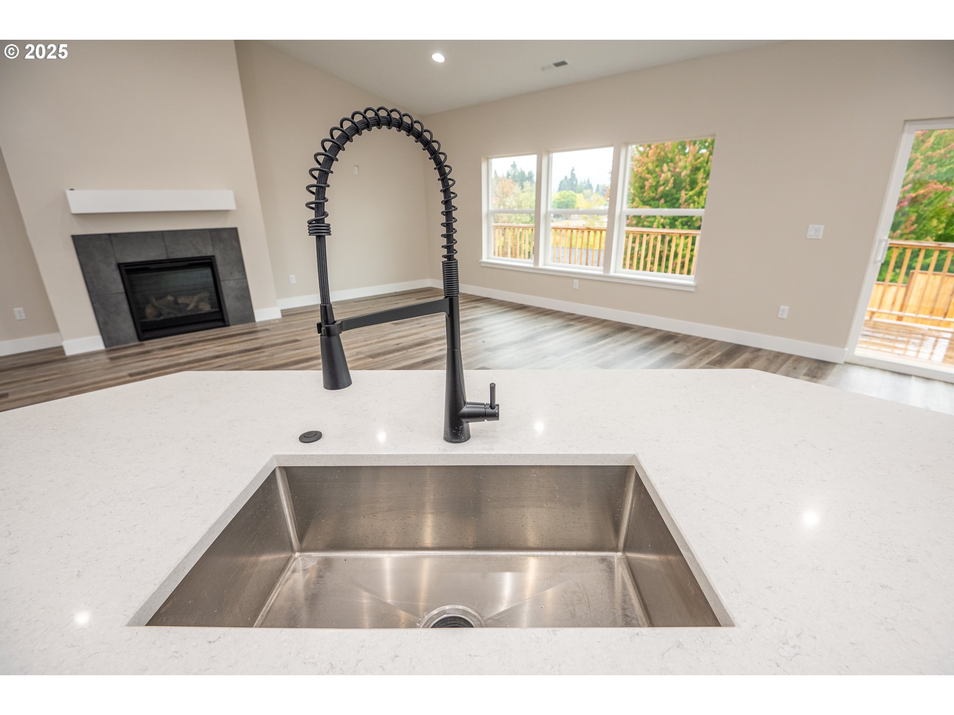 160 Wil Way Winston, OR 97496 - Photo 13 of 37 a living room with a sink and a fireplace