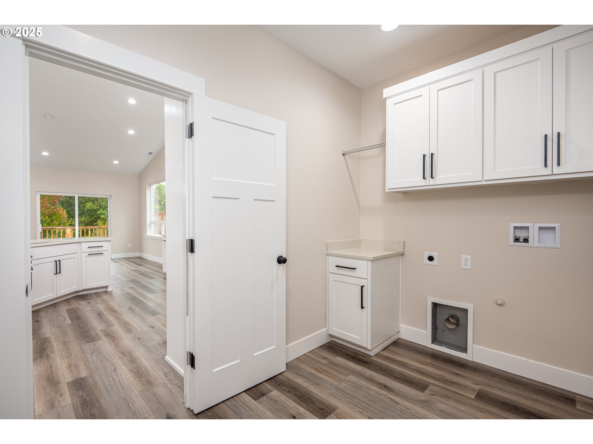 160 Wil Way Winston, OR 97496 - Photo 16 of 37 a view of an empty room with wooden floor and a window