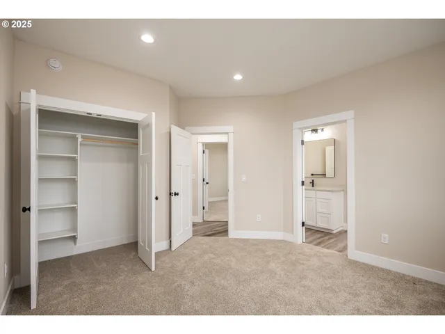 a big room with closet and a bathroom