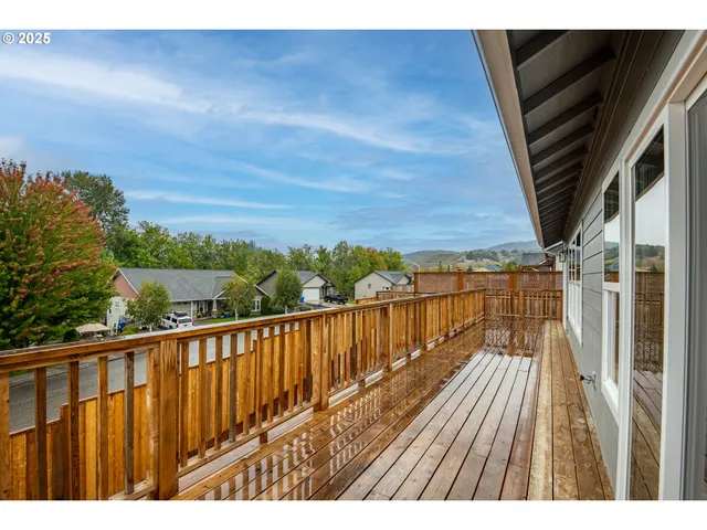 a view of balcony with wooden floor