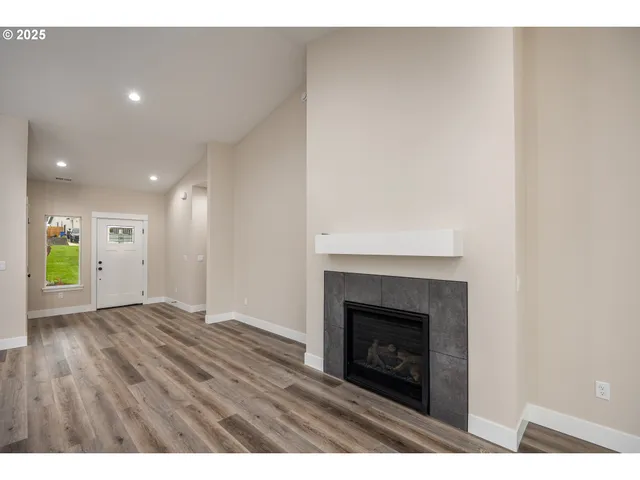 a view of an empty room and fire place