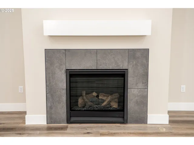 a stone fireplace with a fireplace