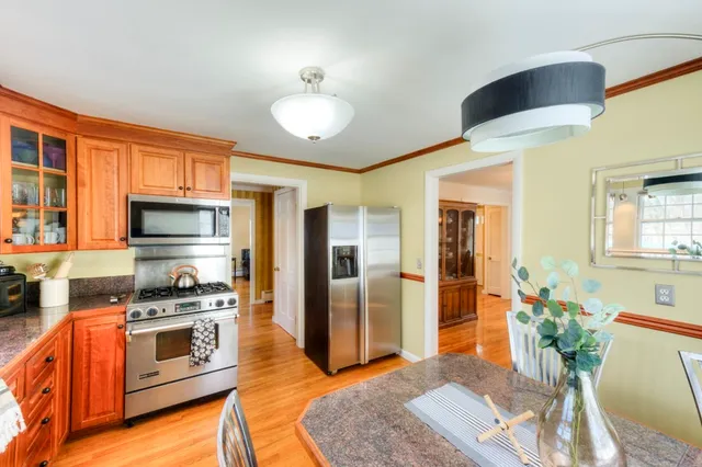 a kitchen with stainless steel appliances a stove sink and cabinets