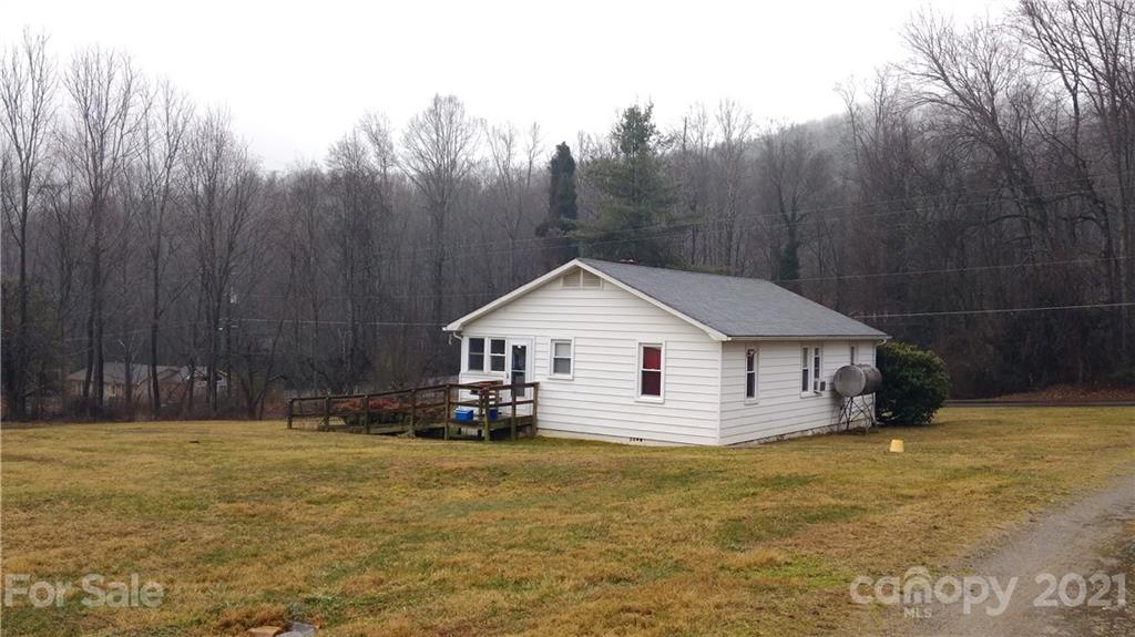 362 Walker Road Waynesville, NC 28786 - Photo 1 of 1 a view of house with backyard and trees in the background